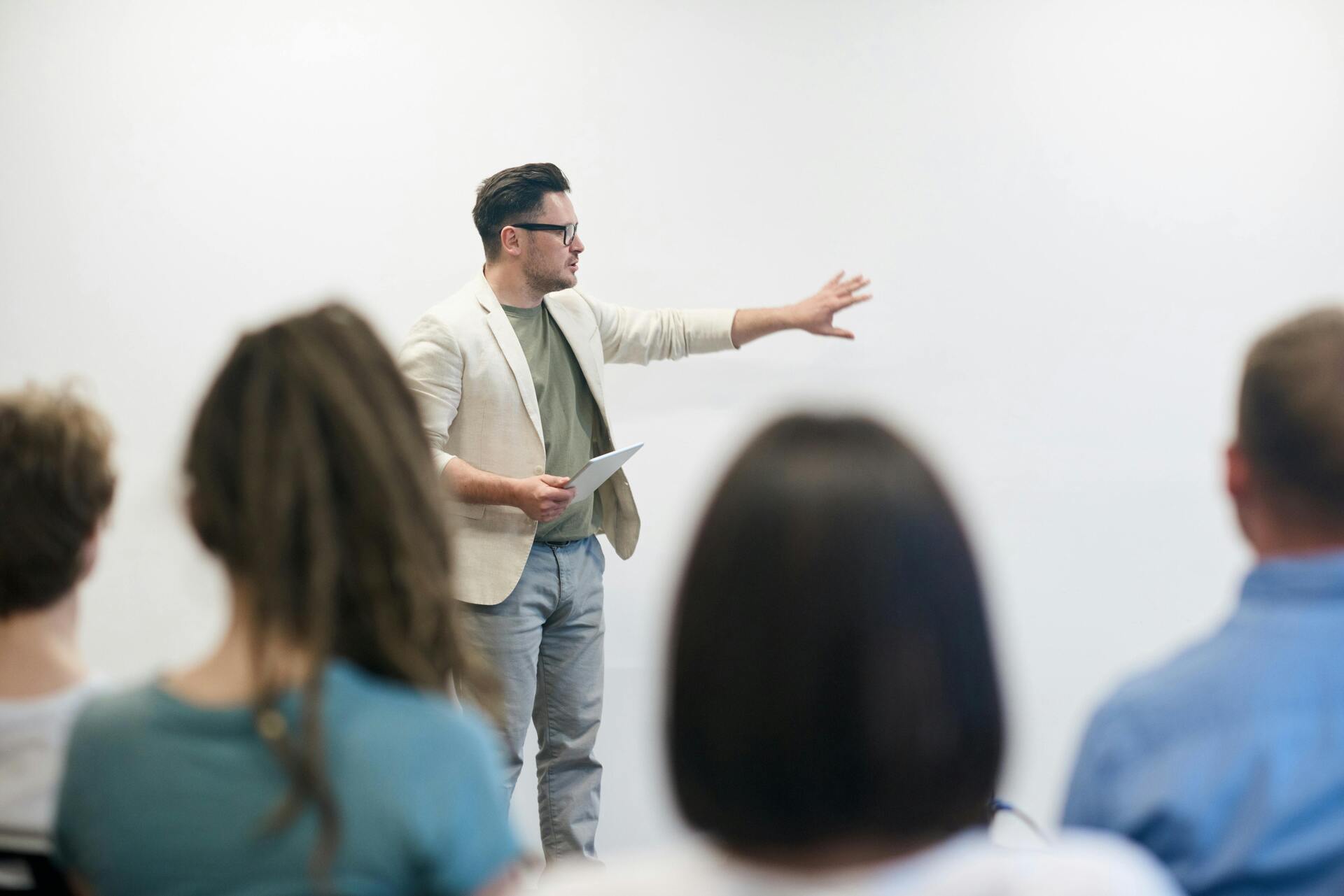 People in a meeting discussing questions